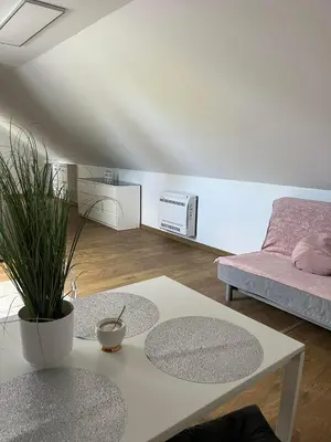 a living room with a couch and a table at Szarów 414 in Szarów