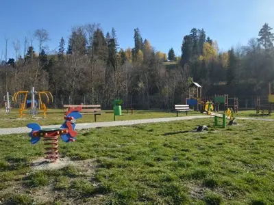 a park with a playground with a toy in the grass at Noclegi u Basi in Klikuszowa