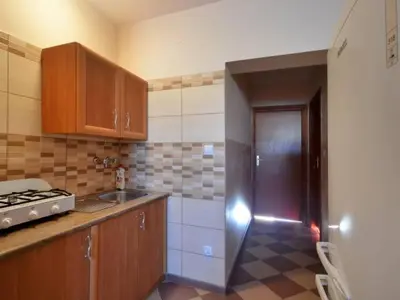 a kitchen with a sink and a counter top at Noclegi u Basi in Klikuszowa