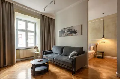 a living room with a couch and a table at P19 Apartments in Kraków