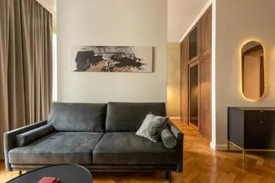 a living room with a couch and a table at P19 Apartments in Kraków