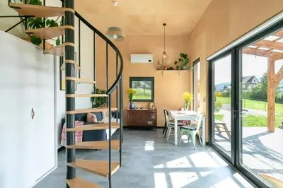 a room with a spiral staircase in a house at Casa Dobra in Dobra