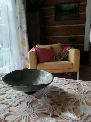 a living room with a table and a couch at Staruszka Chata in Sidzina