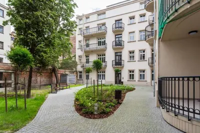 a walkway in front of a building at Dodo Acomodo 6 in Kraków