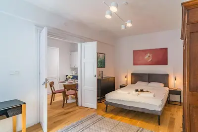 a bedroom with a bed and a desk at Kraków Wawel Apartment - Top Location, Workspace - by Rentujemy in Kraków