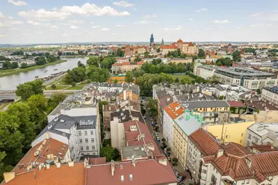 an aerial view of a city with a river and buildings at Kraków Wawel Apartment - Top Location, Workspace - by Rentujemy in Kraków