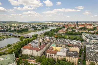 an aerial view of the city and river at Kraków Wawel Apartment - Top Location, Workspace - by Rentujemy in Kraków