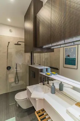 a bathroom with a sink and a toilet and a shower at Kraków Wawel Apartment - Top Location, Workspace - by Rentujemy in Kraków