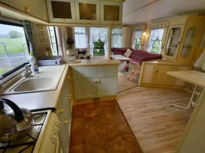 a small kitchen with a sink and a stove at Anser Collis in Wadowice