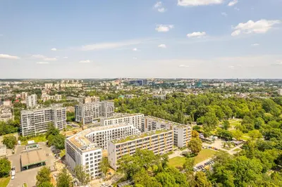 an aerial view of a city with tall buildings at Kraków Old Town - Bus&Tram Stops Nearby, Balcony - by Rentujemy in Kraków