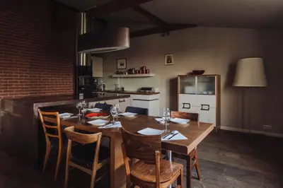 a dining room with a wooden table and chairs at SAW! KRAKÓW Apartments - Studencka in Kraków