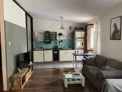 a living room with a couch and a table at Piekny,duzy loft 80 metrow blisko centrum in Kraków