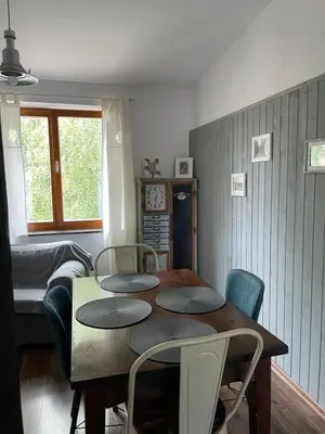 a dining room with a table and chairs at Piekny,duzy loft 80 metrow blisko centrum in Kraków