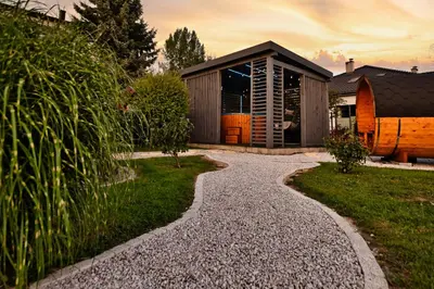 a gravel path leading to a house at Wiklinowa Oaza Zator by Housine in Zator