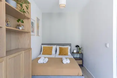 a living room with a large glass wall at Modern Apartment CityBeat#10 in Kraków