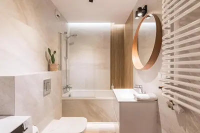 a bathroom with a toilet and a shower with a plant at Modern Apartment CityBeat#10 in Kraków