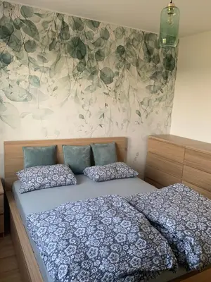 a bedroom with a bed with two pillows on it at Smile 2 in Tomice