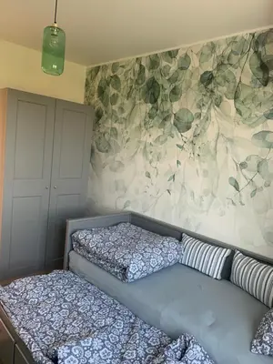 a bedroom with a bed and a wall at Smile 2 in Tomice