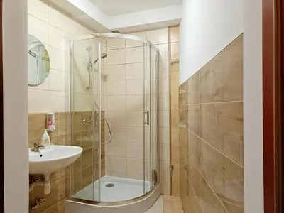 a bathroom with a shower and a sink at pokoje przytulnie jak w domu in Kraków