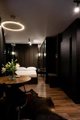 a room with a bed and a table and a room with a bed at Native Apartments Kościuszki 39I11 in Kraków