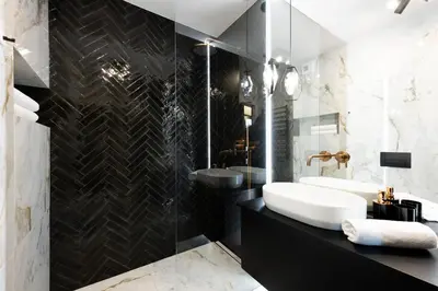 a black and white bathroom with a sink and a tub at Native Apartments Kościuszki 39I11 in Kraków