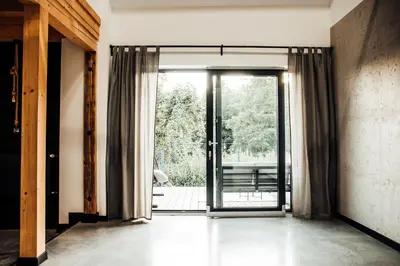 an open door to a patio with a view at Stodoła Na Kamionce in Kwaczała