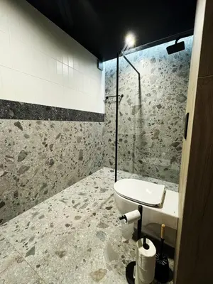 a bathroom with a toilet and a sink at Stodoła Na Kamionce in Kwaczała