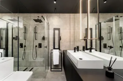 a bathroom with two sinks and a shower at Wiślane Tarasy - UNIQUE Apartments 4YOU - 9 piętro z pięknym widokiem na centrum Krakowa in Kraków