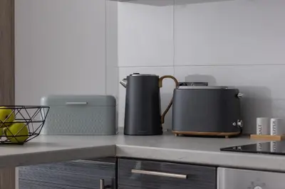 a kitchen counter with two heaters on a counter top at Apartament w Spokojnej Okolicy z Parkingiem by Noclegi Renters in Kraków
