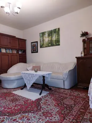 a living room with a couch and a table at Dom w Beskidzie Wyspowym in Słopnice