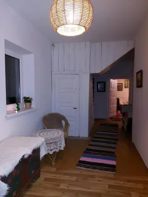 a living room with a bed and a table at Dom w Beskidzie Wyspowym in Słopnice