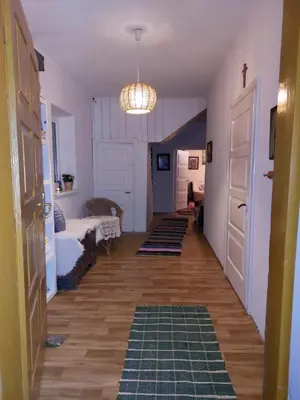 a hallway with a room with a bed and a door at Dom w Beskidzie Wyspowym in Słopnice