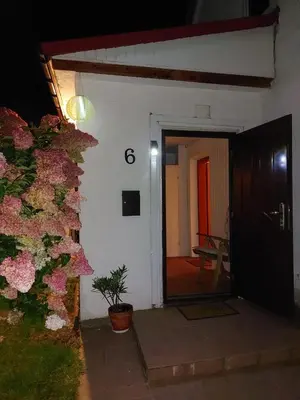a front door of a house with a plant at Dom w Beskidzie Wyspowym in Słopnice