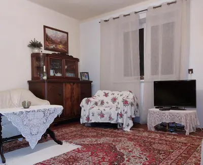 a living room with a couch and a tv at Dom w Beskidzie Wyspowym in Słopnice
