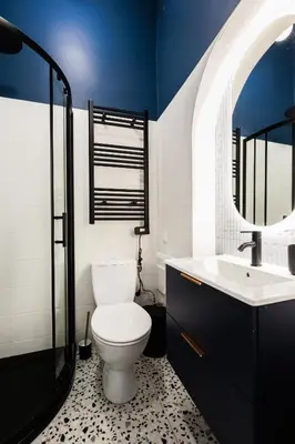 a bathroom with a toilet and a sink at Comfort Central Studio - by Upstairs in Kraków
