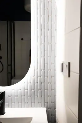 a bathroom with a sink and a mirror at Comfort Central Studio - by Upstairs in Kraków