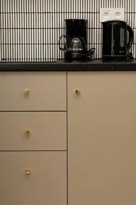a counter with a coffee maker on top of it at Comfort Central Studio - by Upstairs in Kraków