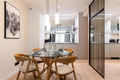 a dining room with a table and chairs at Boutique Wawel Side in Kraków