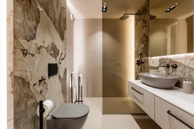 a bathroom with a white toilet and a sink at Boutique Wawel Side in Kraków