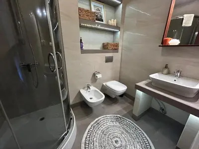a bathroom with a shower and a toilet and a sink at Old Town Apartments - free parking Przemysłowa str in Kraków