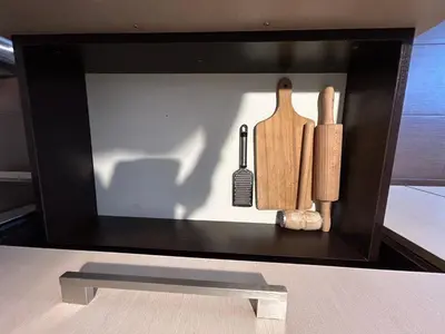 a display case with a knife and other kitchen utensils at Old Town Apartments - free parking Przemysłowa str in Kraków
