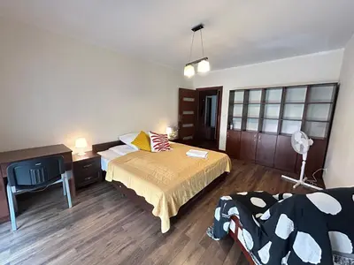 a bedroom with a bed and a desk and a television at Old Town Apartments - free parking Przemysłowa str in Kraków