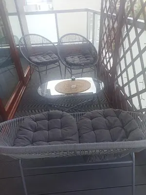 a set of chairs sitting on a balcony at Apartament Białoprądnicki Siewna in Kraków