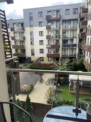 a balcony with a view of a large building at Apartament Grzegórzecka centrum in Kraków