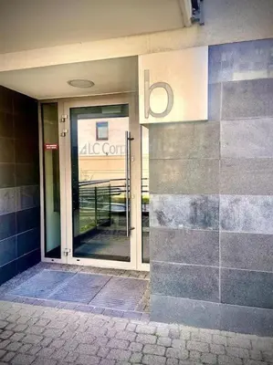 an entrance to a building with a glass door at Apartament Grzegórzecka centrum in Kraków