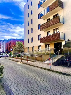 a building on a street in front of a building at Apartament Grzegórzecka centrum in Kraków