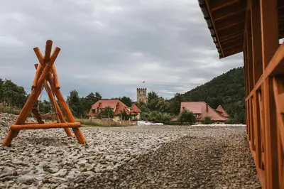 a wooden object sitting on a rocky ground at Chata Zawrot in Wytrzyszczka