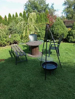 a picnic table and a bench in a yard at Cracow house under walnut tree in Kraków
