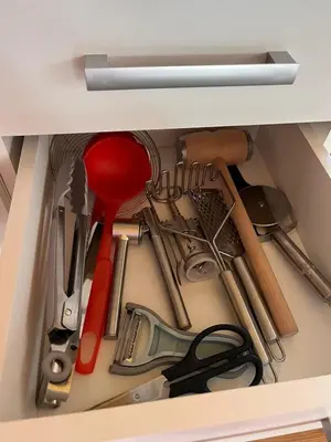 a drawer filled with lots of kitchen utensils at Domki- Limanowa domek 3 domek z jacuzzi i sauną in Limanowa