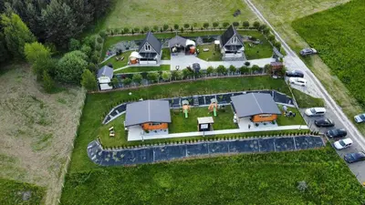 an aerial view of a house with a yard at Domki- Limanowa domek 3 domek z jacuzzi i sauną in Limanowa